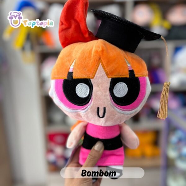 Peluche de graduación con birrete, estola y detalles académicos