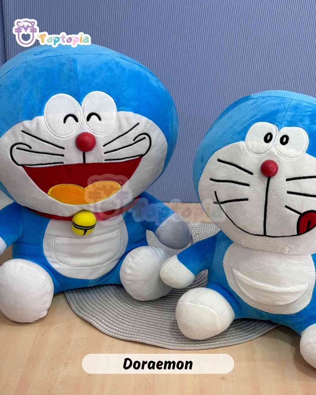 Peluche Doraemon original azul sentado, gato cósmico con nariz roja y sonrisa tierna